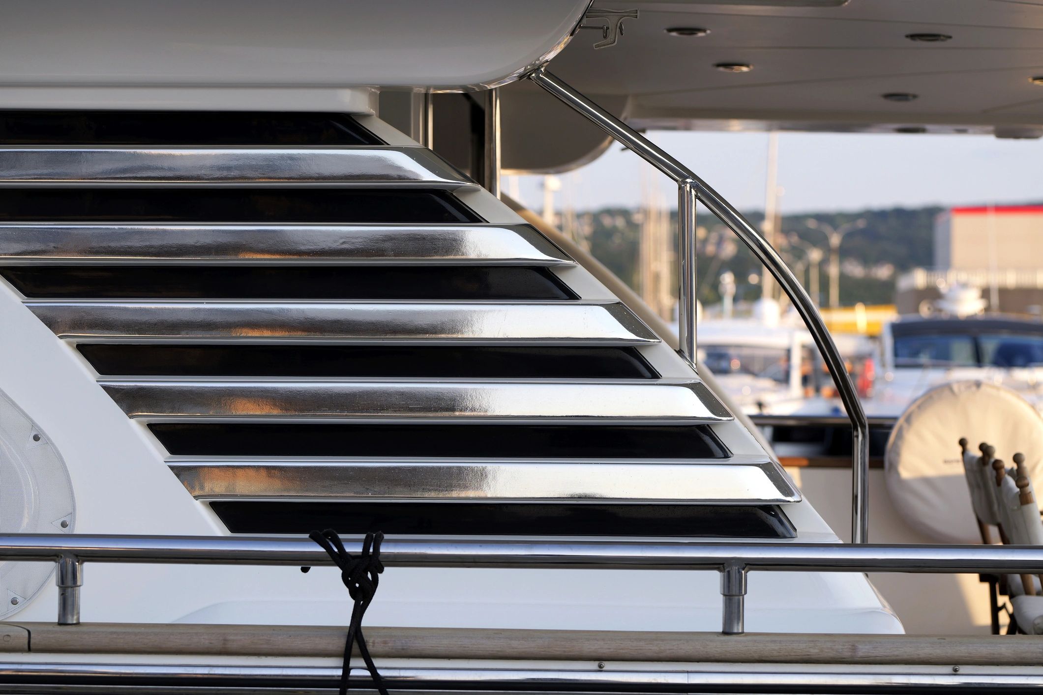 Luxury yacht interior staircase with polished railings